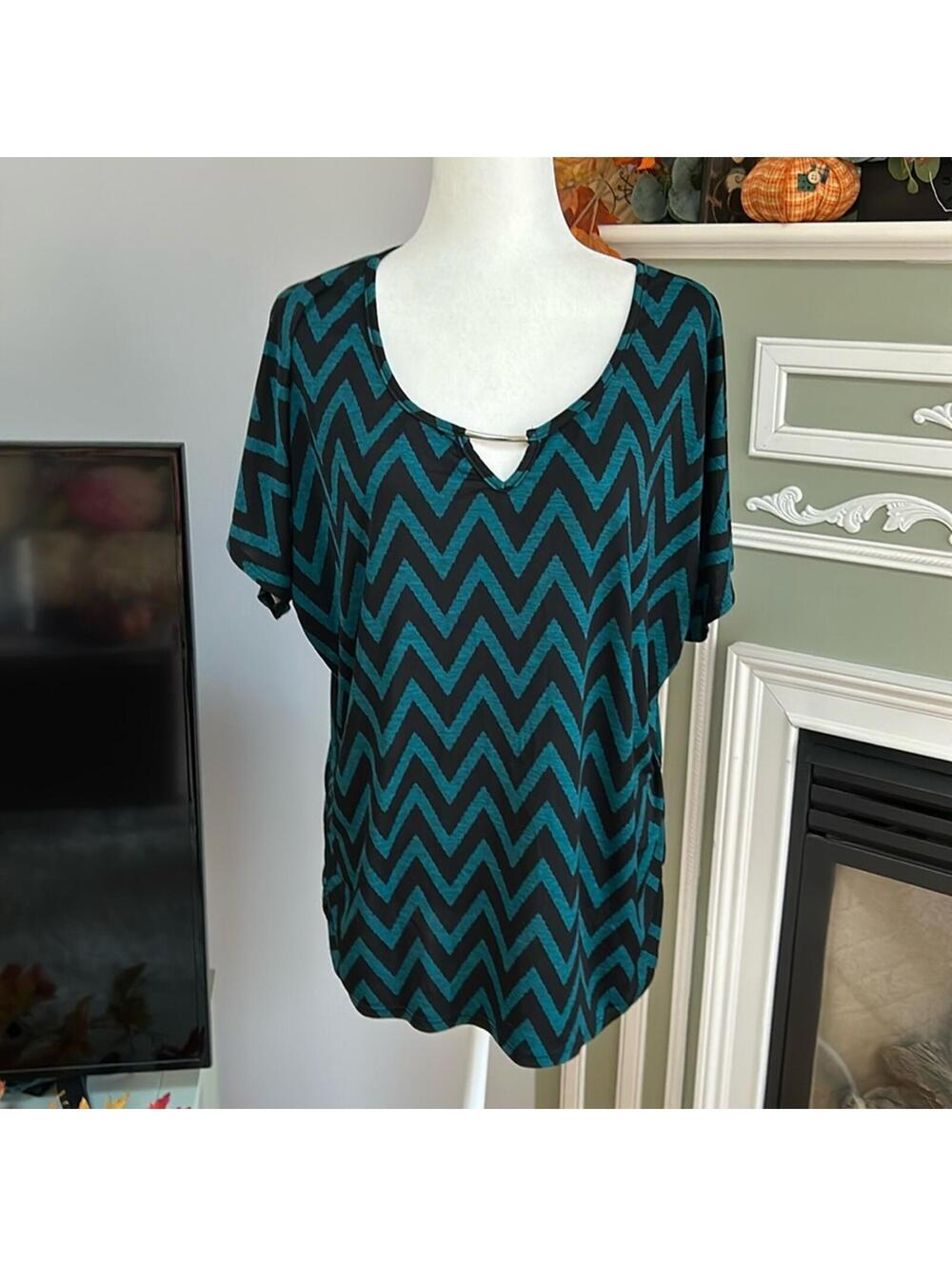Lavish Plush chevron top with metal neck feature and ruched sides